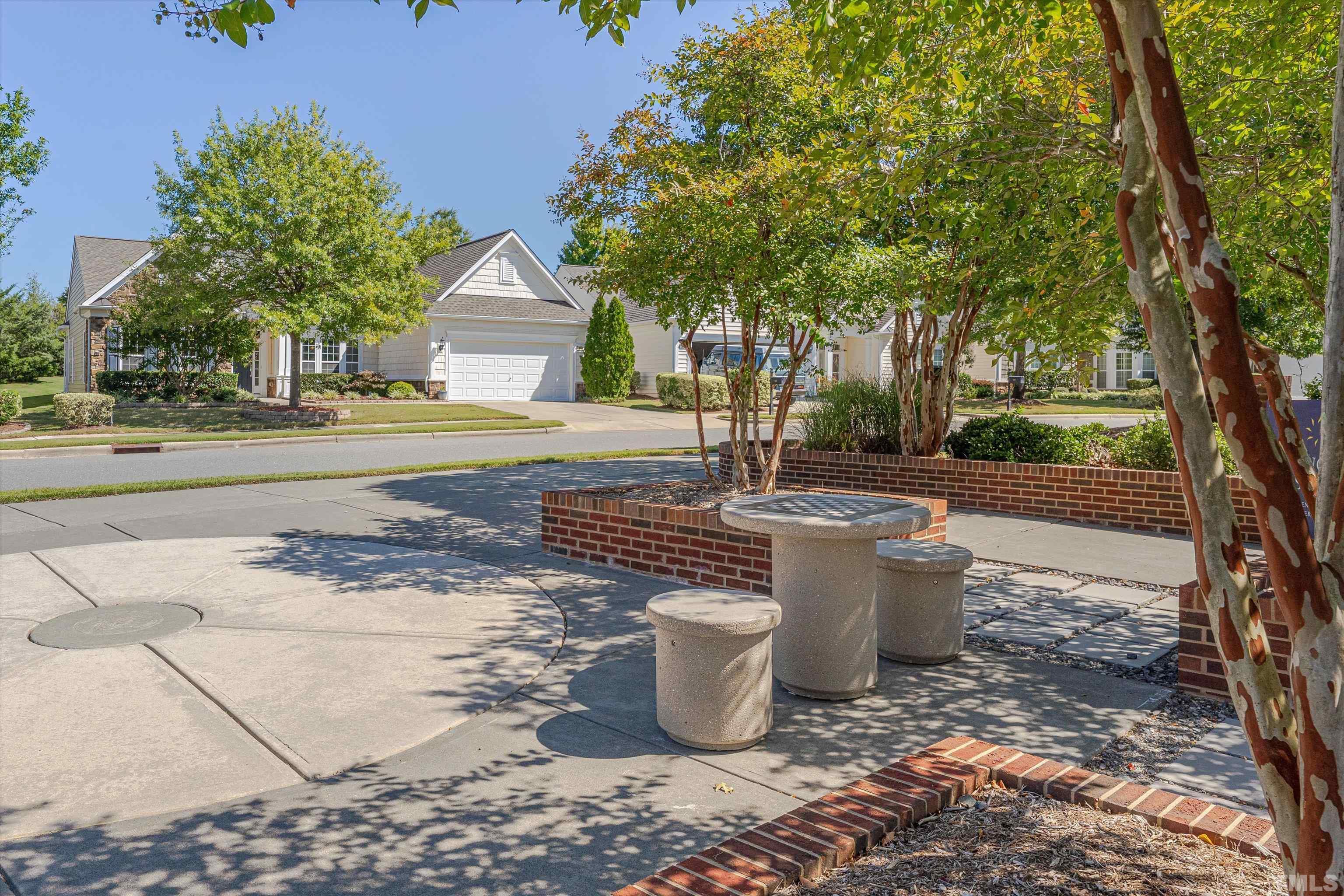 315 Beckingham Loop Cary, NC 27519 - Photo 31 of 34 a view of a backyard that has plants and trees