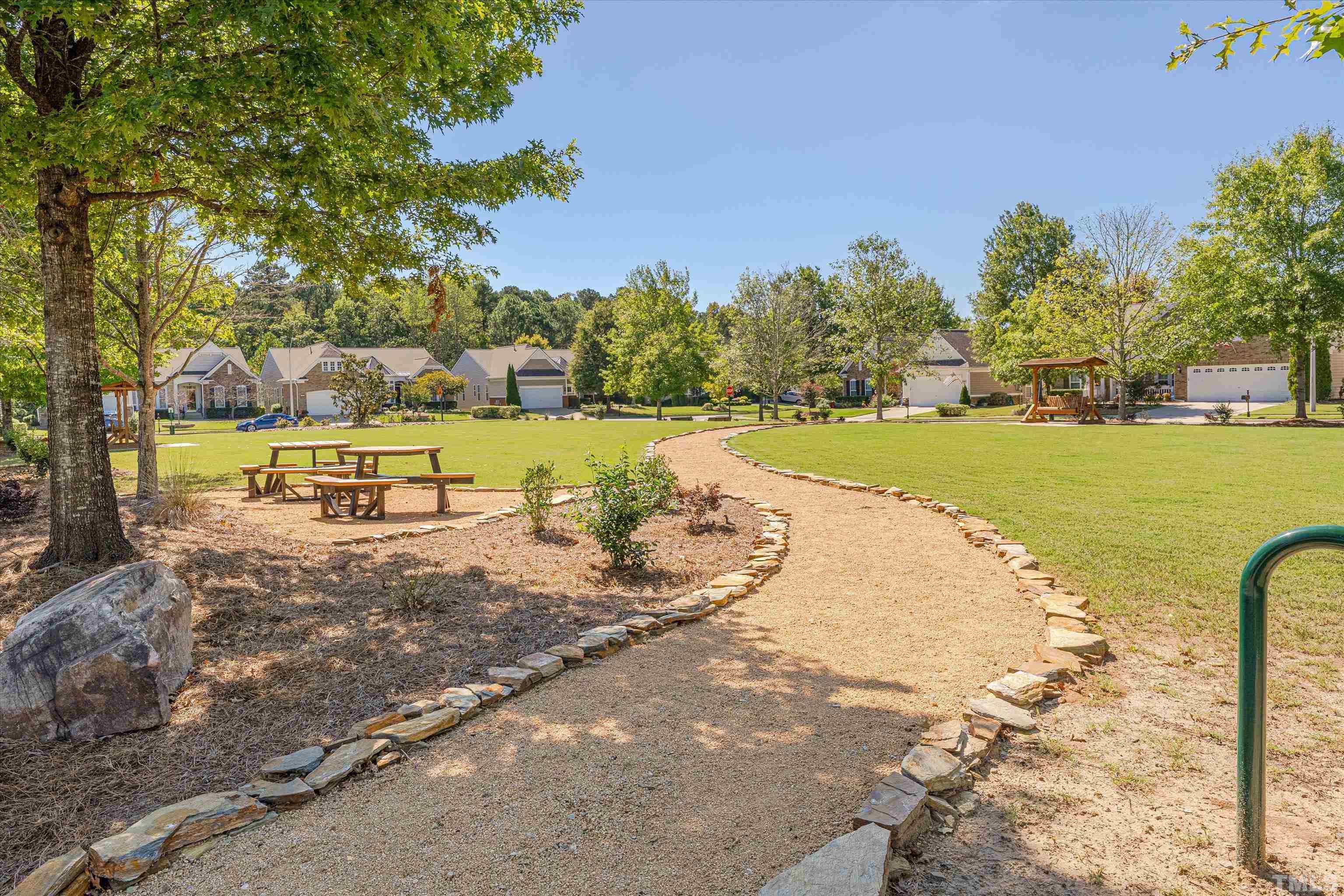 315 Beckingham Loop Cary, NC 27519 - Photo 32 of 34 a view of a lake with a big yard
