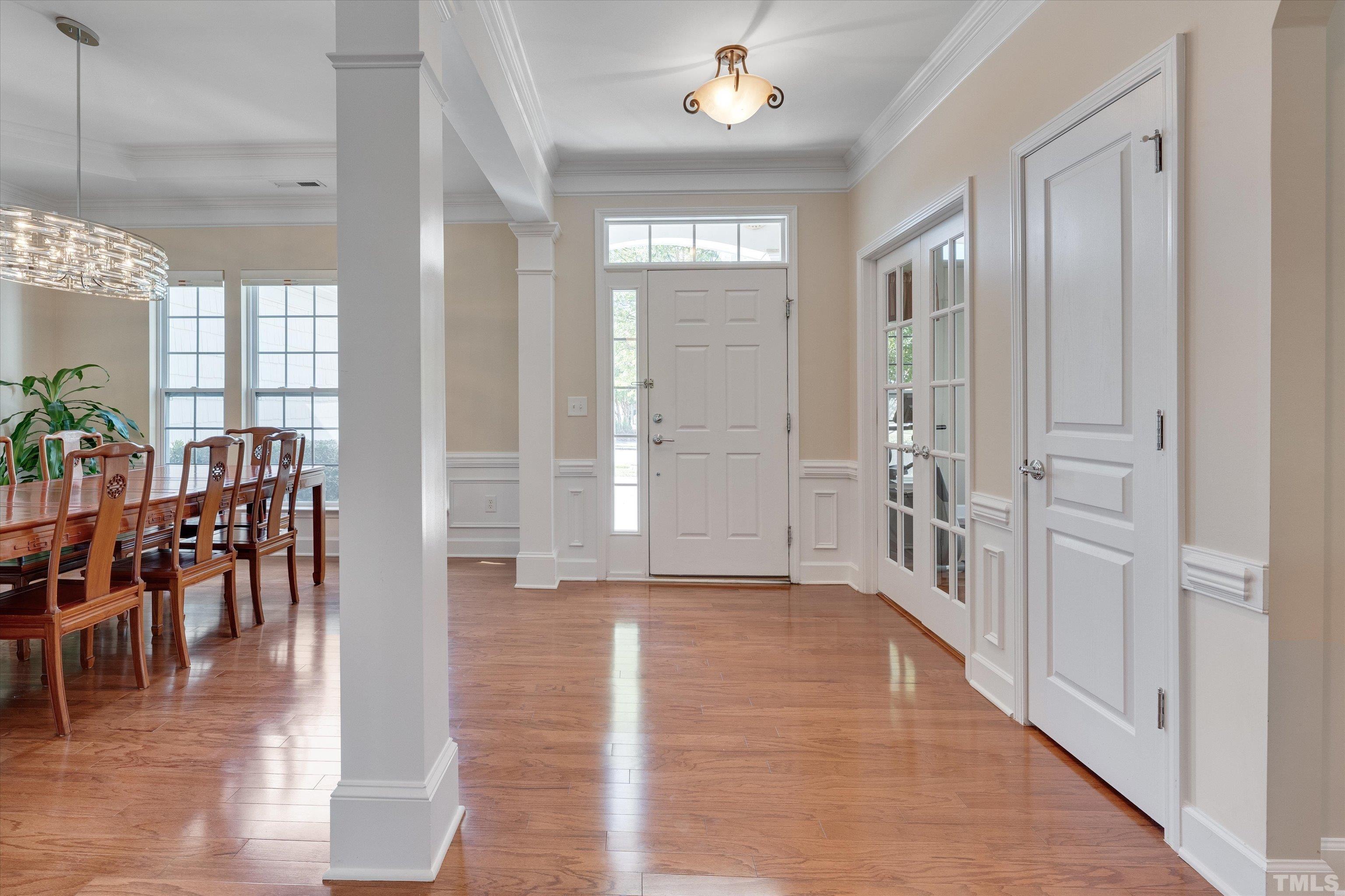 315 Beckingham Loop Cary, NC 27519 - Photo 4 of 34 an entryway space with chandelier in dining room