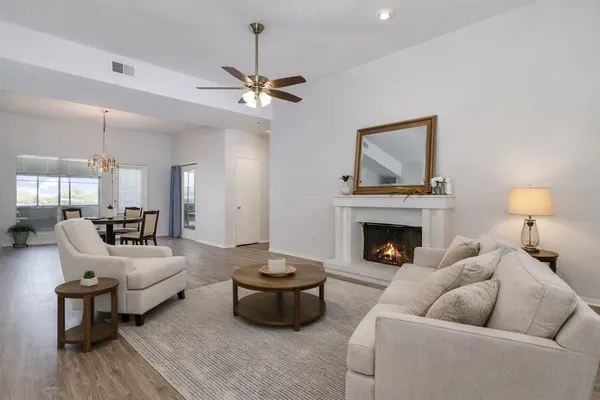 a living room with furniture and a fireplace