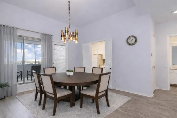 a view of a dining room with furniture and window