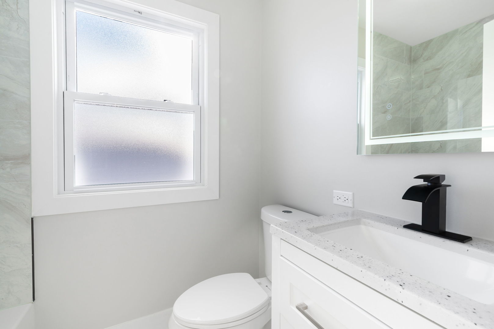 9633 South Yale Avenue Chicago, IL 60628 - Photo 12 of 26 a bathroom with a granite countertop toilet sink and mirror