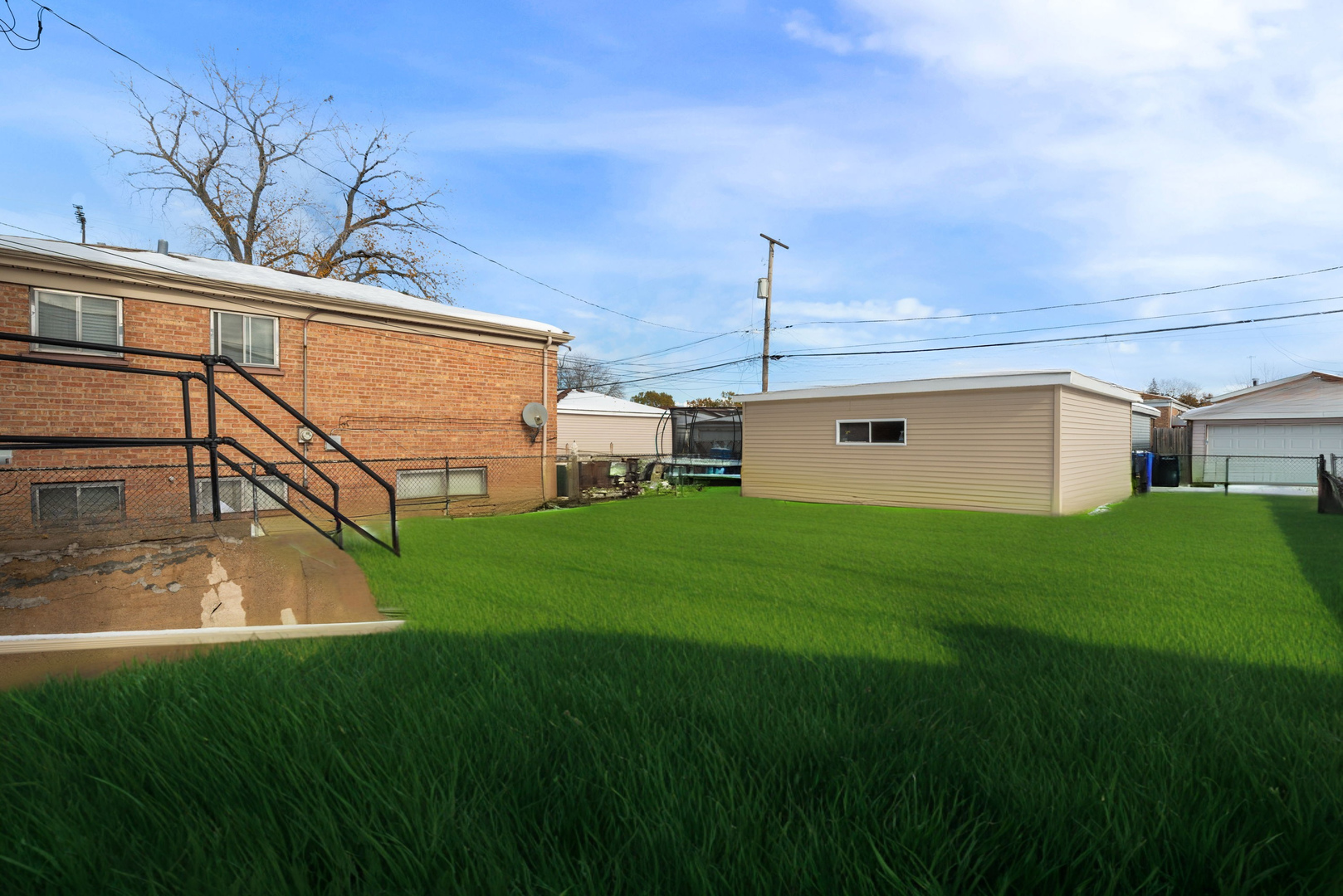 9633 South Yale Avenue Chicago, IL 60628 - Photo 25 of 26 a view of a backyard with plants