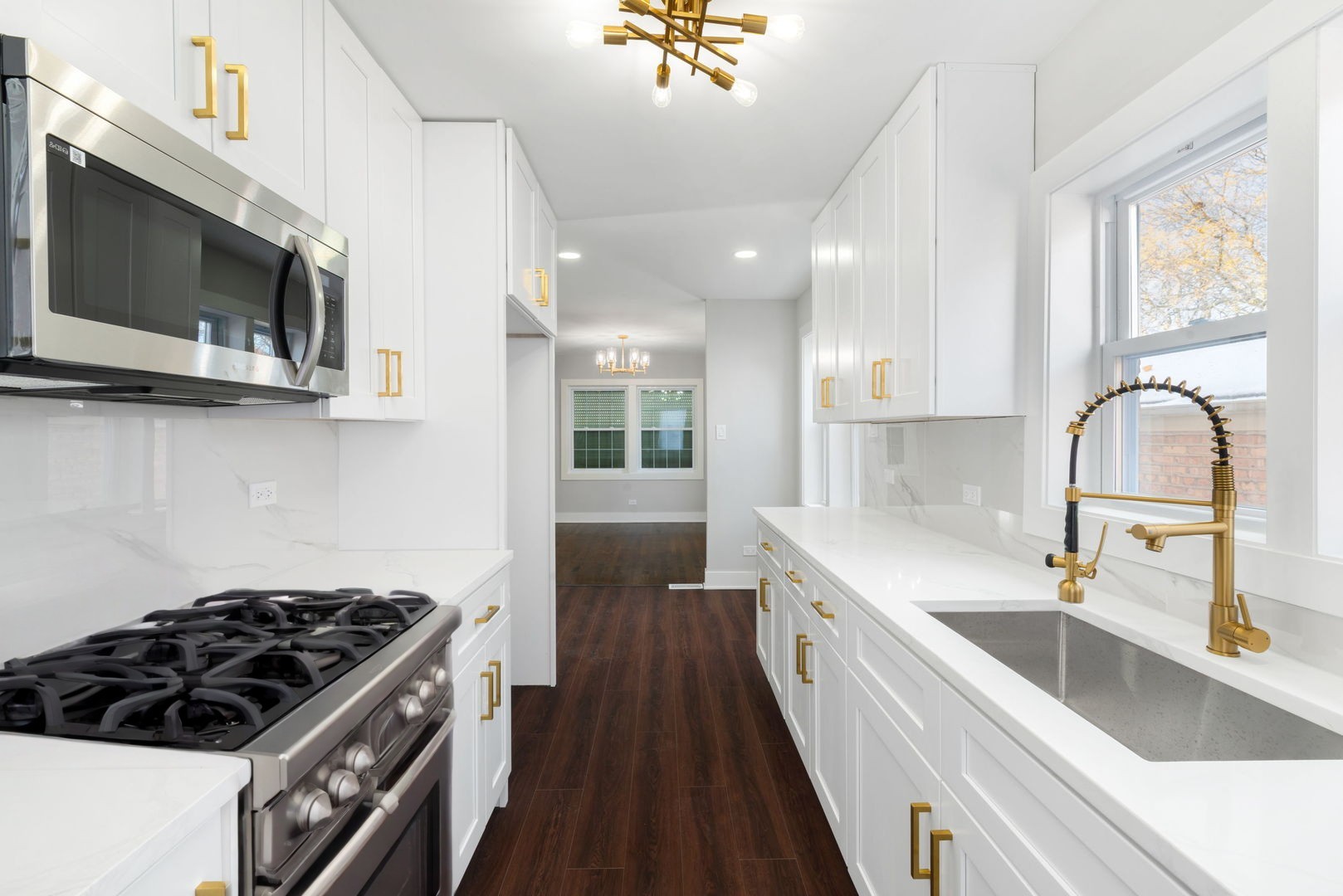 9633 South Yale Avenue Chicago, IL 60628 - Photo 9 of 26 a kitchen with stainless steel appliances a sink a stove and microwave