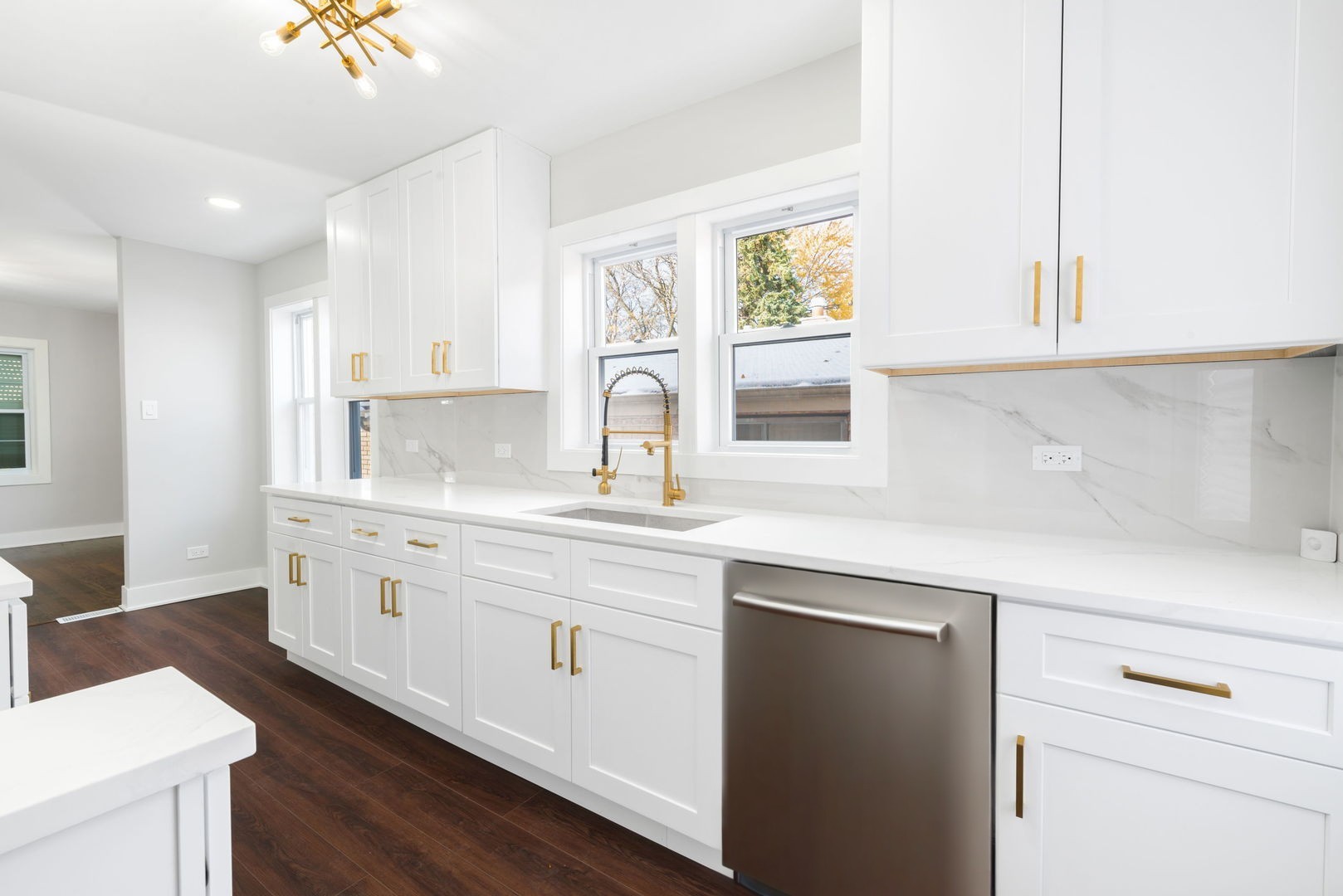 9633 South Yale Avenue Chicago, IL 60628 - Photo 10 of 26 a kitchen with granite countertop white cabinets and white appliances