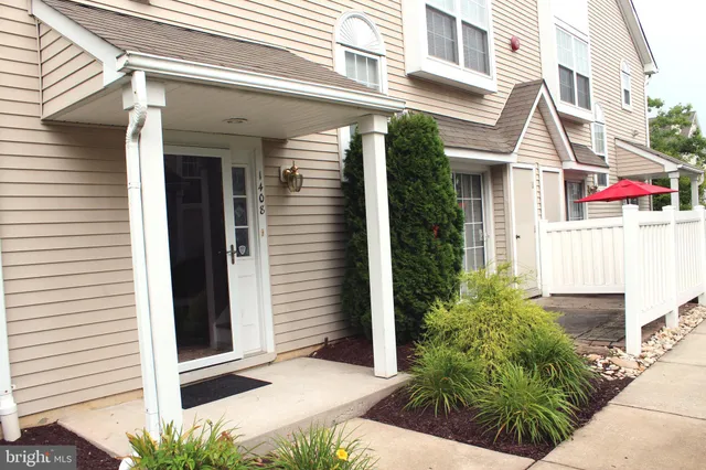 a view of a white building with many windows