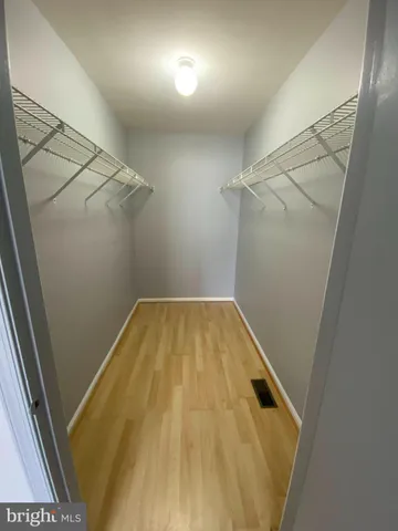 a view of a room with racks on the wall