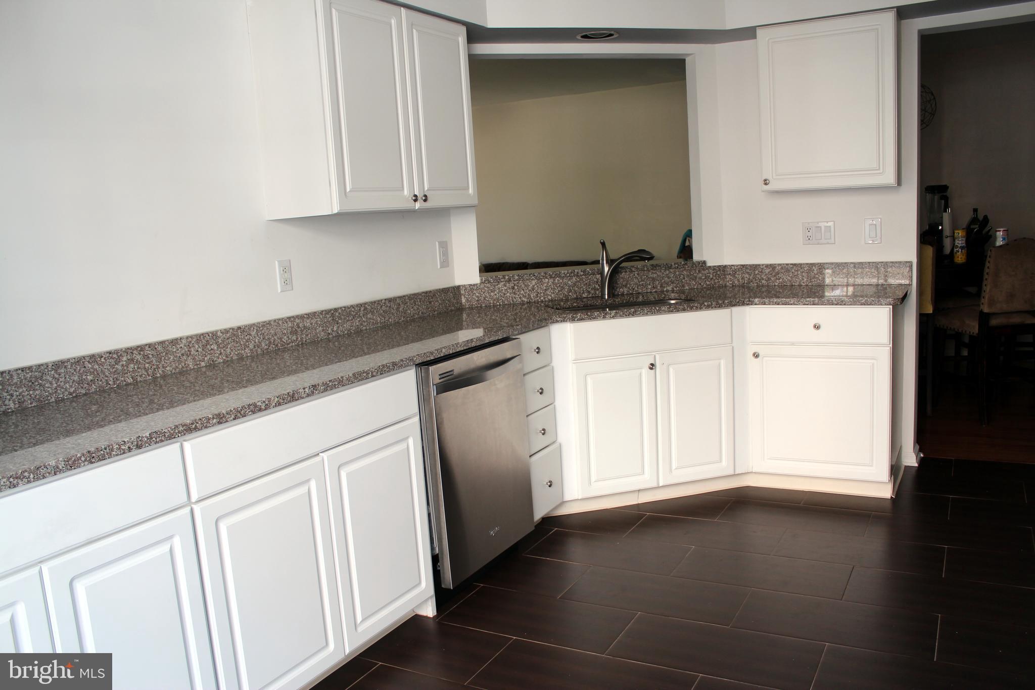 1408 Wharton Road Mount Laurel, NJ 08054 - Photo 8 of 23 a white kitchen with granite countertop white cabinets and a granite counter tops