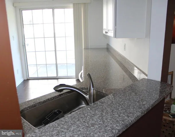 a view of a kitchen cabinets sink and window