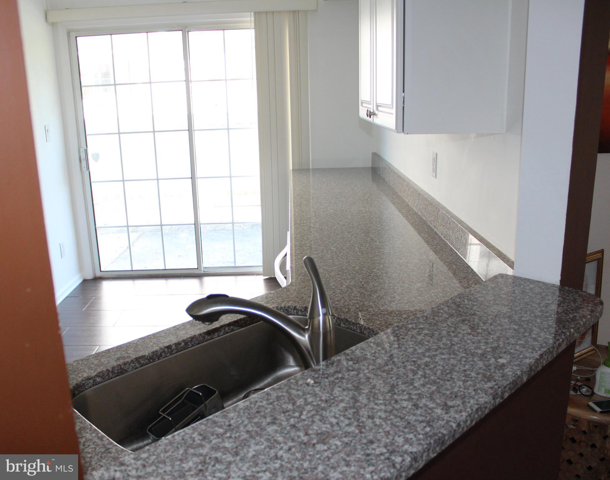1408 Wharton Road Mount Laurel, NJ 08054 - Photo 9 of 23 a view of a kitchen cabinets sink and window