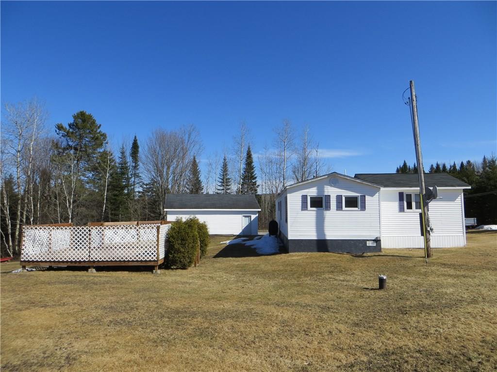 11 Country Lane Road Madawaska, ME 04756 - Photo 17 of 25 Well-landscaped. Wellhead visible.