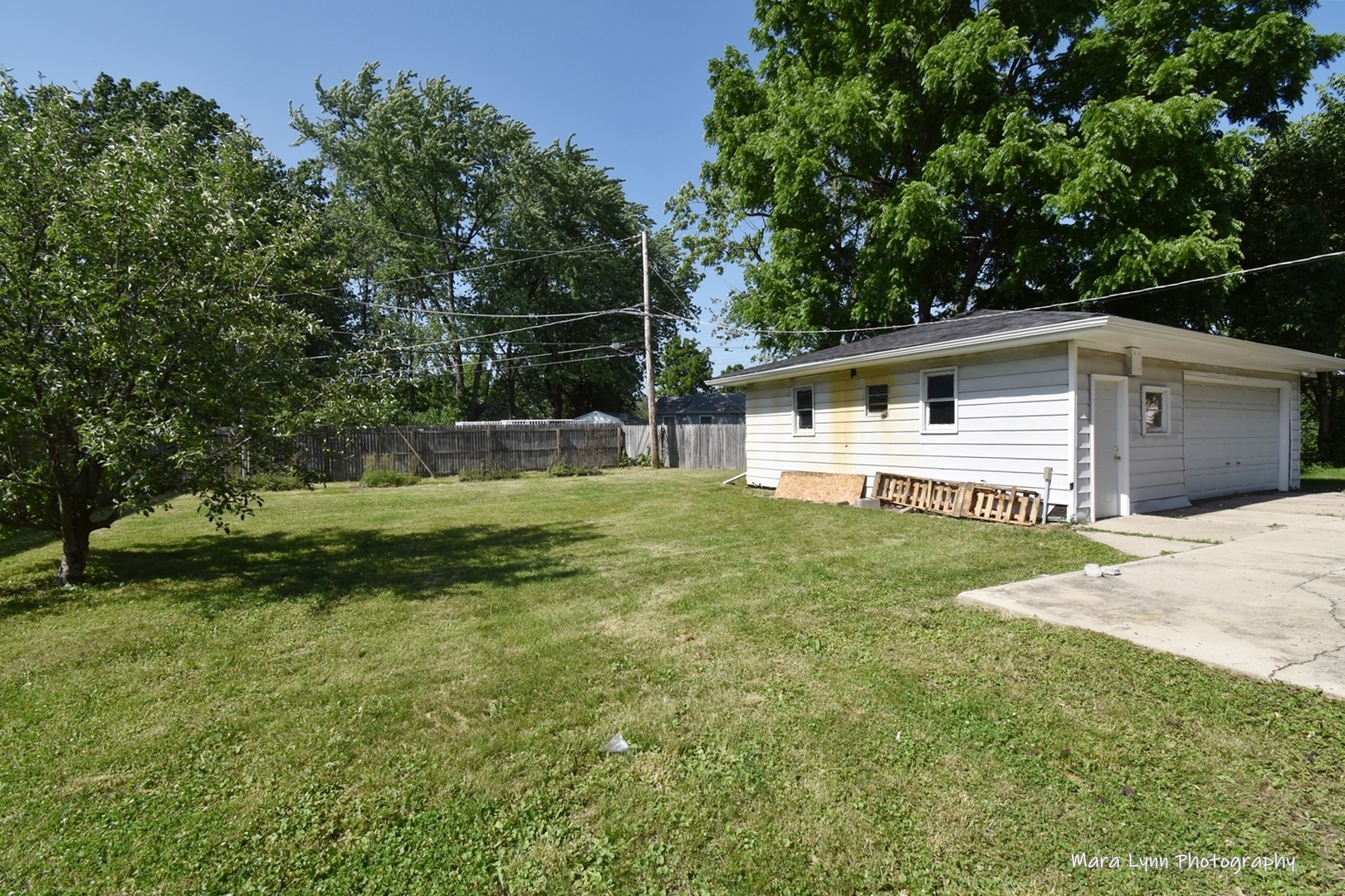2413 Pecan Street Joliet, IL 60435 - Photo 13 of 14 a view of a backyard with a garden and trees