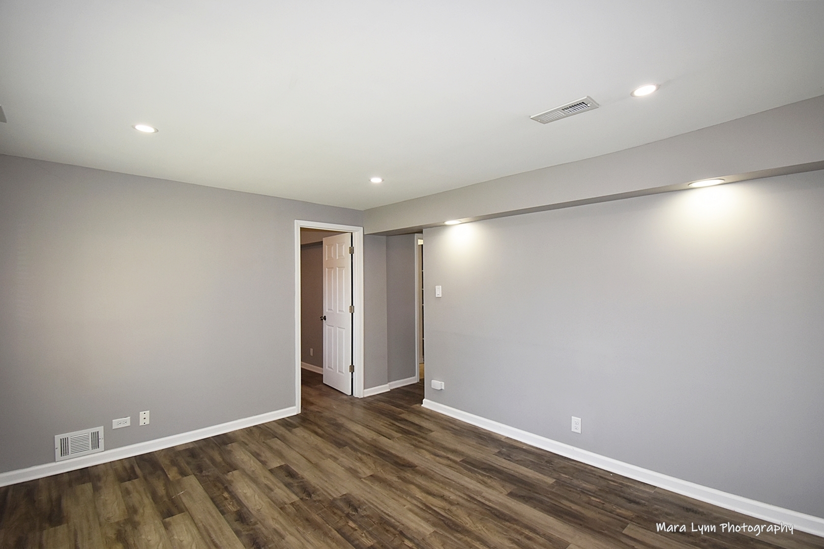 2413 Pecan Street Joliet, IL 60435 - Photo 5 of 14 an empty room with wooden floor and windows