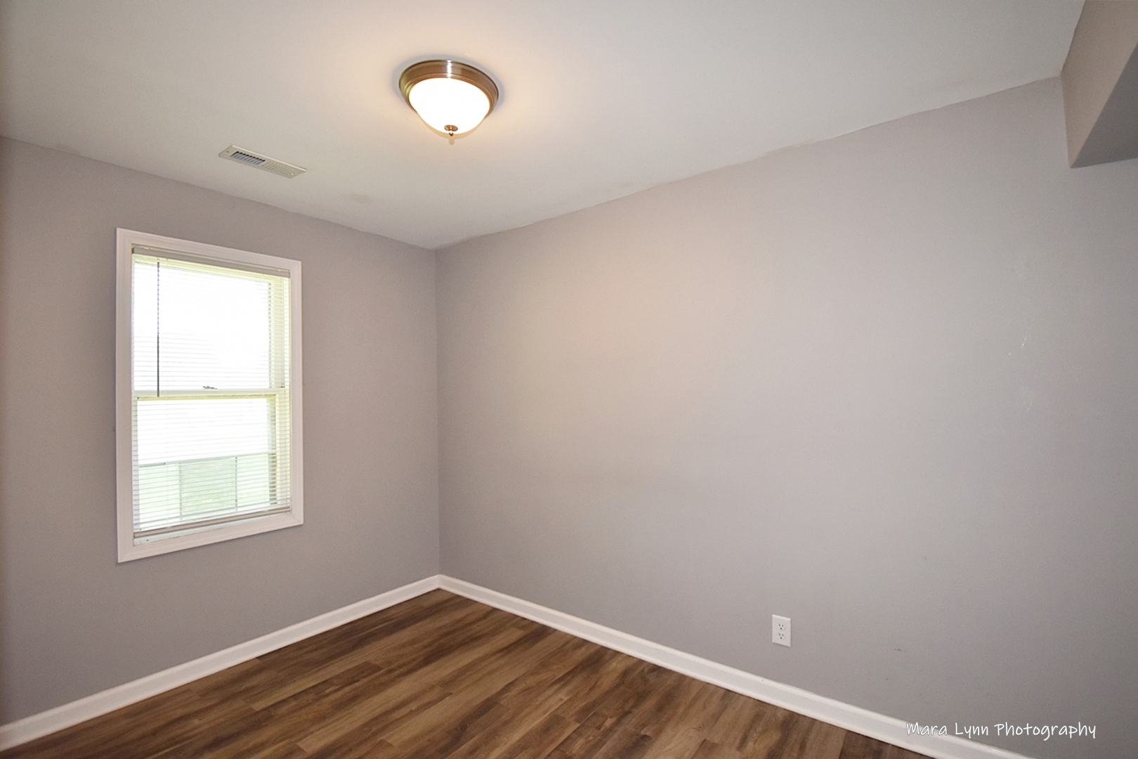 2413 Pecan Street Joliet, IL 60435 - Photo 7 of 14 an empty room with a window
