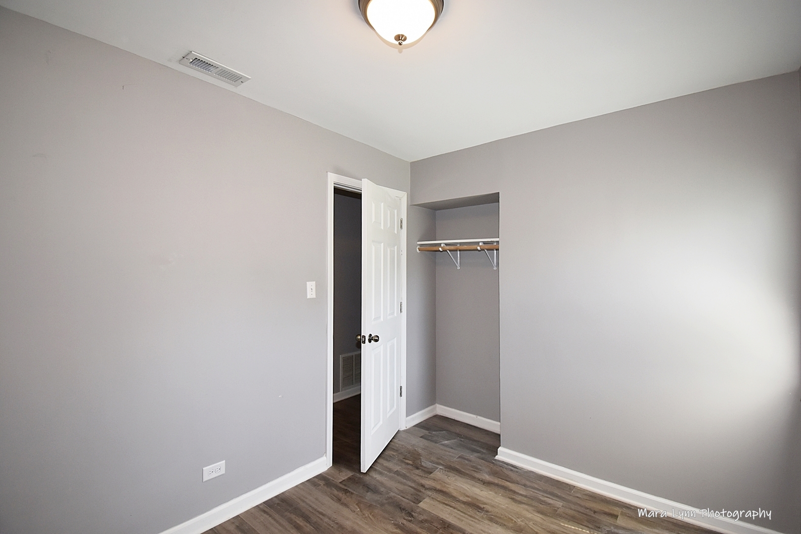 2413 Pecan Street Joliet, IL 60435 - Photo 9 of 14 a view of an empty room with wooden floor
