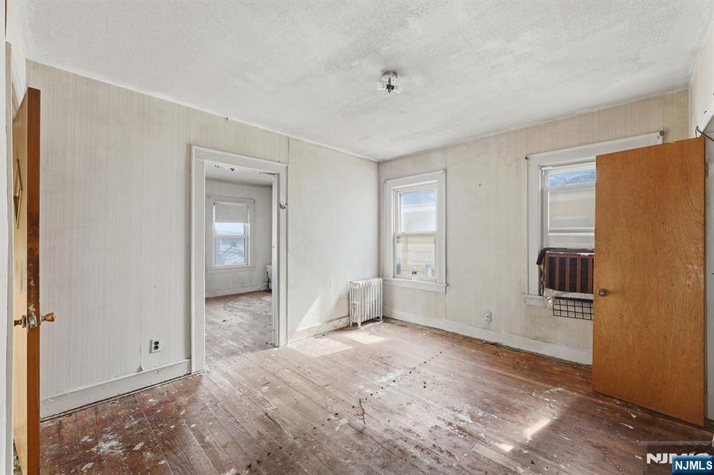 1024 Julia Street Elizabeth, NJ 07201 - Photo 11 of 30 a view of empty room with wooden floor