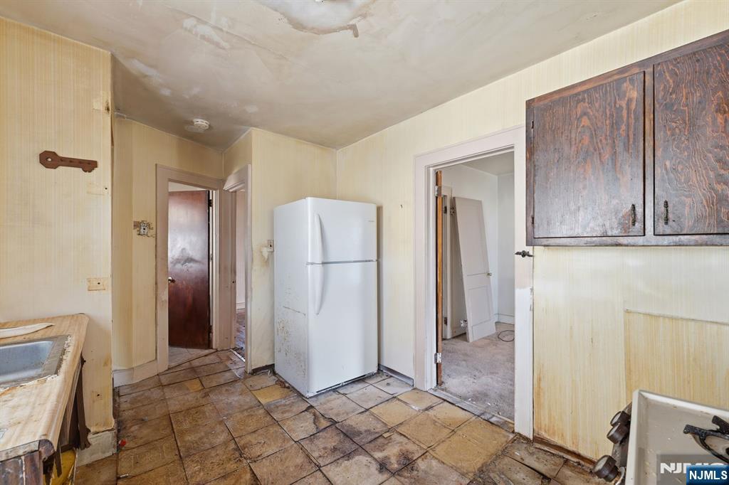 1024 Julia Street Elizabeth, NJ 07201 - Photo 13 of 30 a view of a kitchen with refrigerator and cabinet