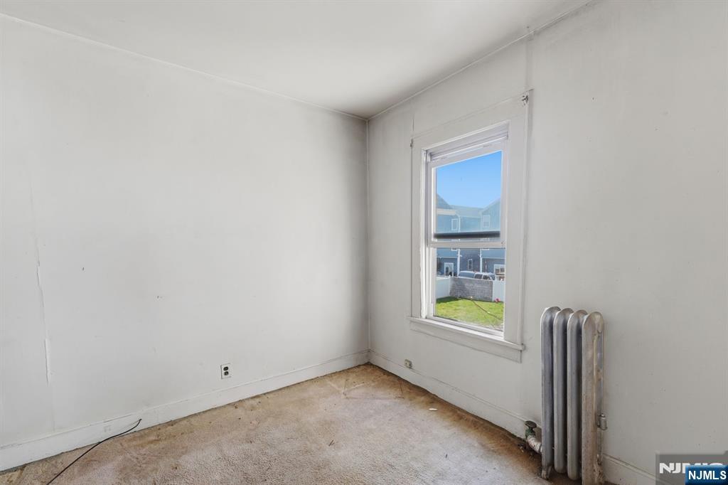 1024 Julia Street Elizabeth, NJ 07201 - Photo 15 of 30 an empty room with windows