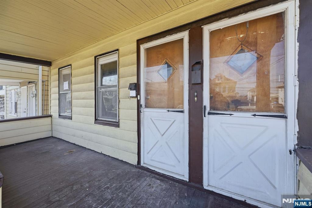 1024 Julia Street Elizabeth, NJ 07201 - Photo 2 of 30 a view of an entryway with wooden floor and door