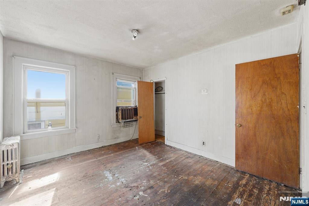1024 Julia Street Elizabeth, NJ 07201 - Photo 7 of 30 an empty room with windows