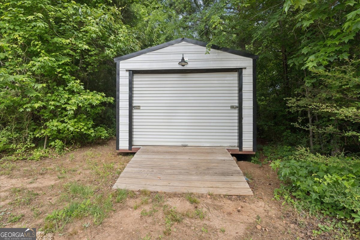 683 Teagle Road Forsyth, GA 31029 - Photo 39 of 50 a front view of a house with a yard