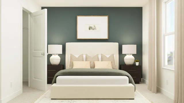 a bed sitting in a bedroom and painting on the wall