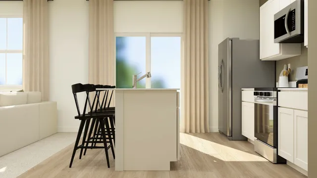 a view of kitchen with furniture and wooden floor