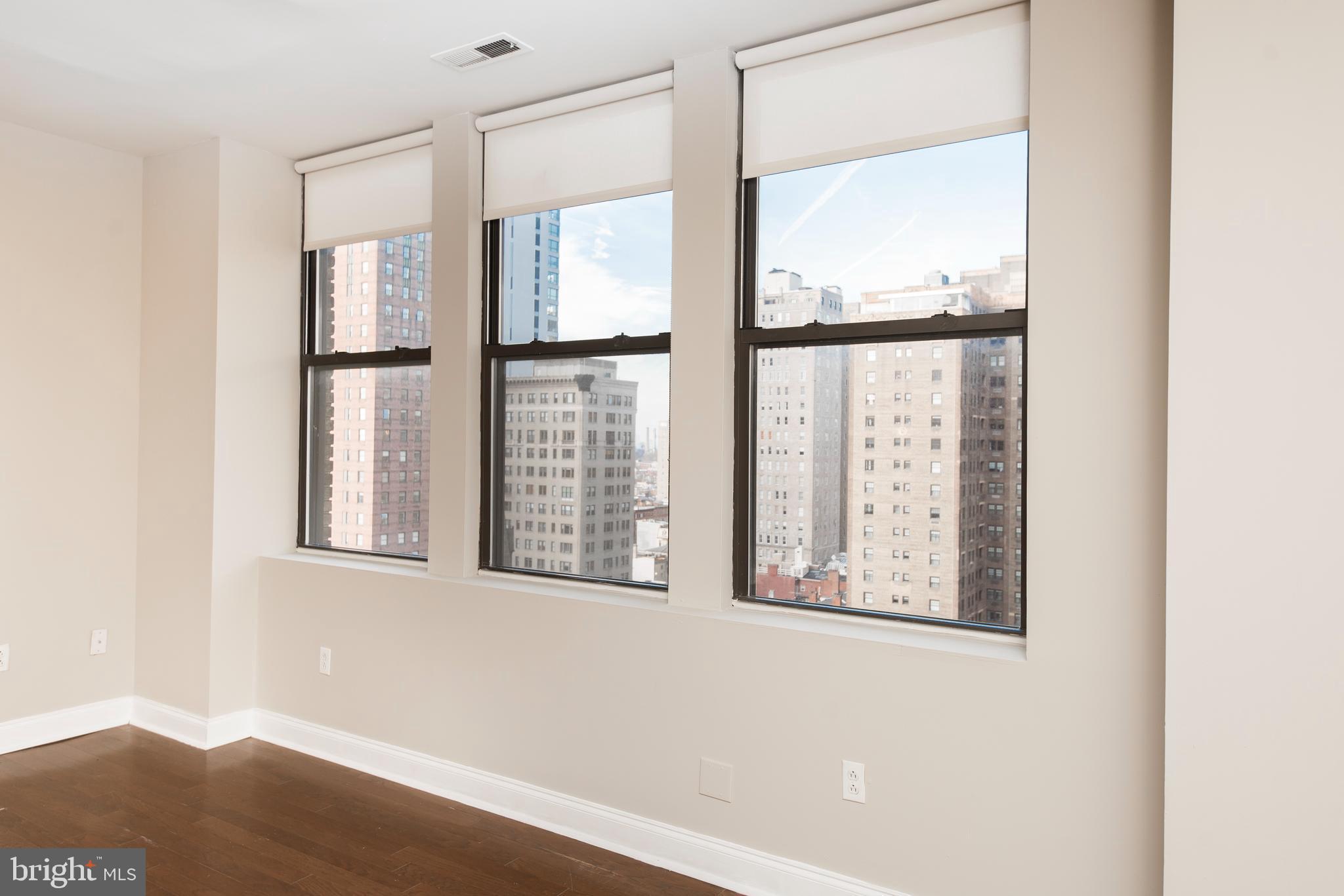 220 South 16th Street, Unit 1102 Philadelphia, PA 19102 - Photo 14 of 26 a view of an empty room with a window
