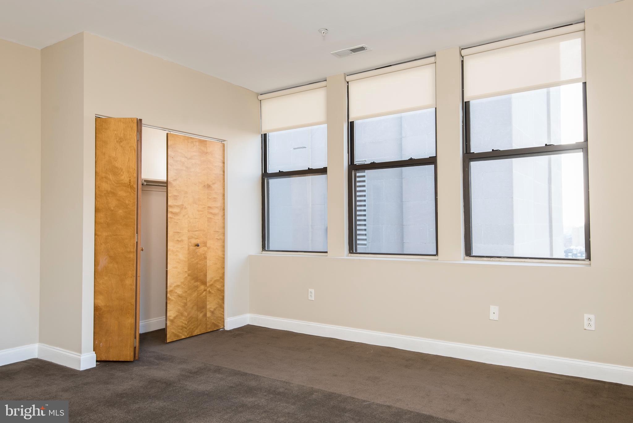 220 South 16th Street, Unit 1102 Philadelphia, PA 19102 - Photo 17 of 26 a view of an empty room with a window