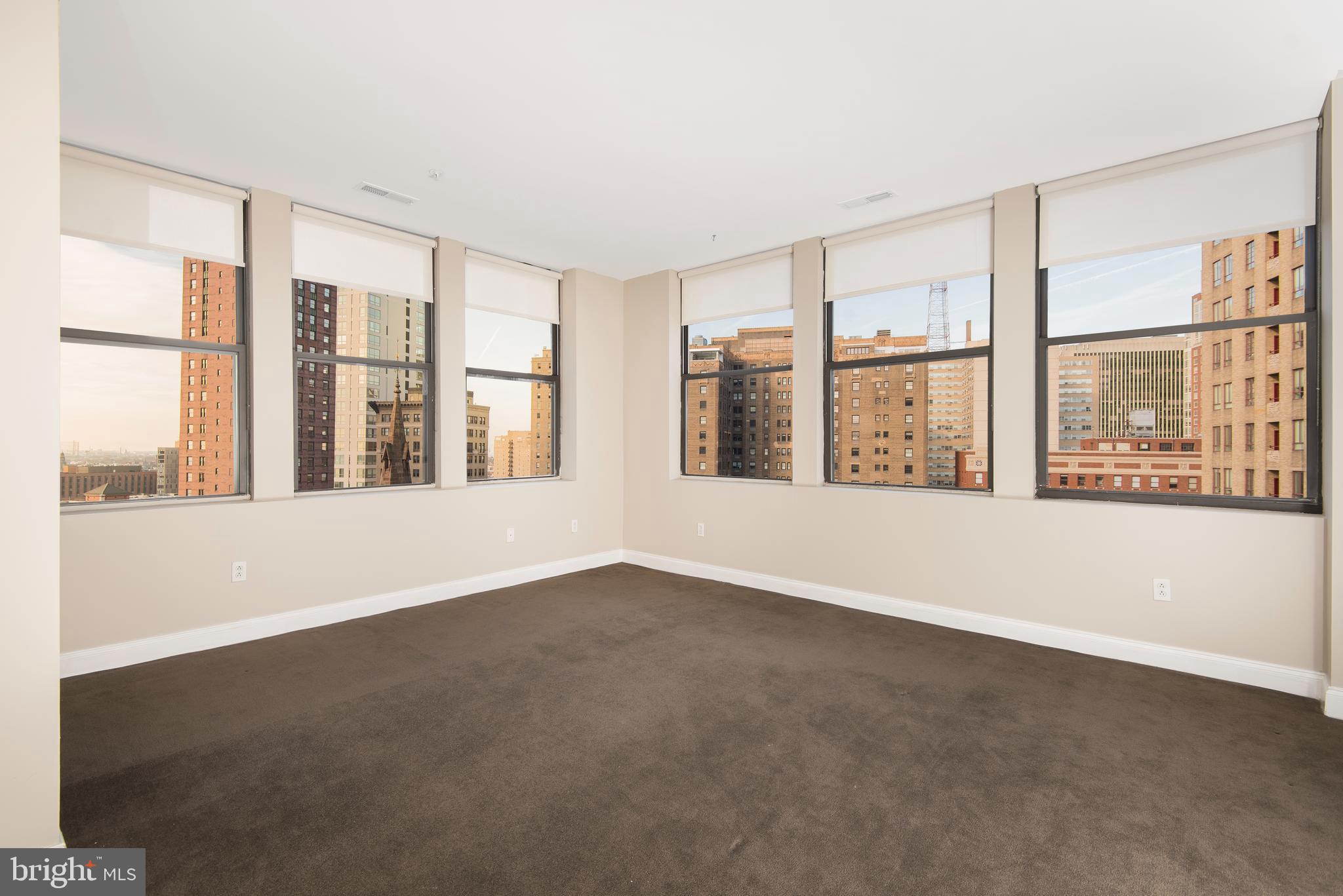 220 South 16th Street, Unit 1102 Philadelphia, PA 19102 - Photo 18 of 26 a view of an empty room with a large window