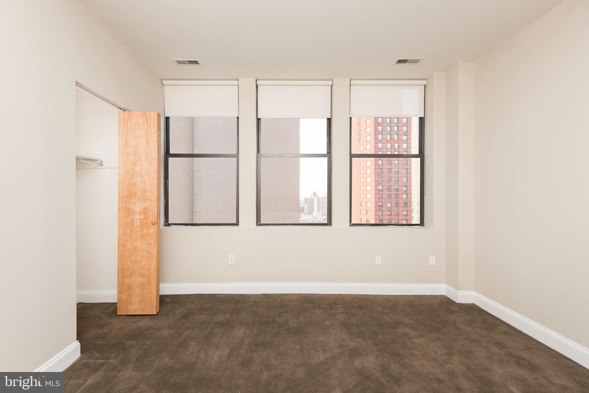 220 South 16th Street, Unit 1102 Philadelphia, PA 19102 - Photo 19 of 26 a view of an empty room with a window