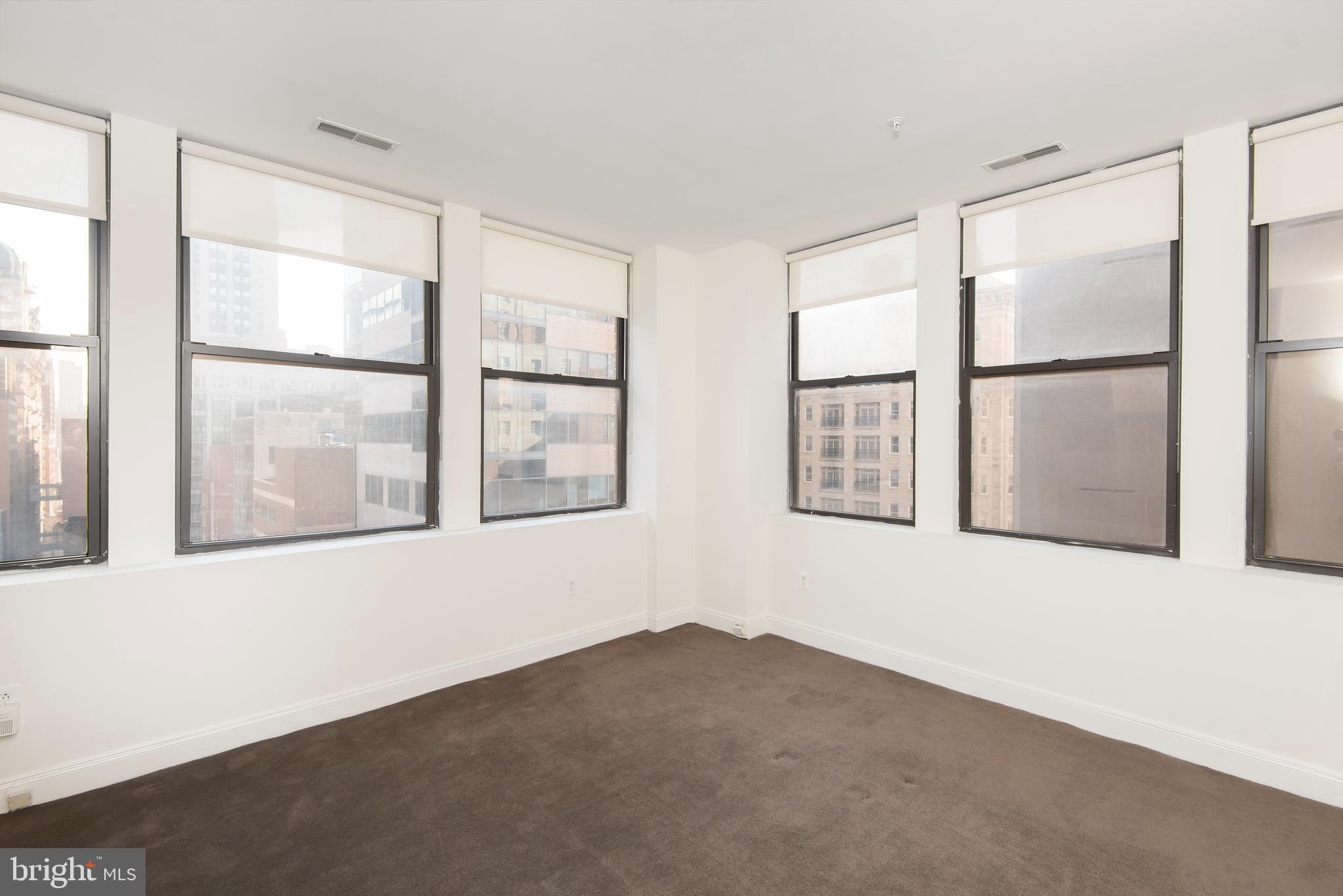 220 South 16th Street, Unit 1102 Philadelphia, PA 19102 - Photo 21 of 26 a view of an empty room with a window