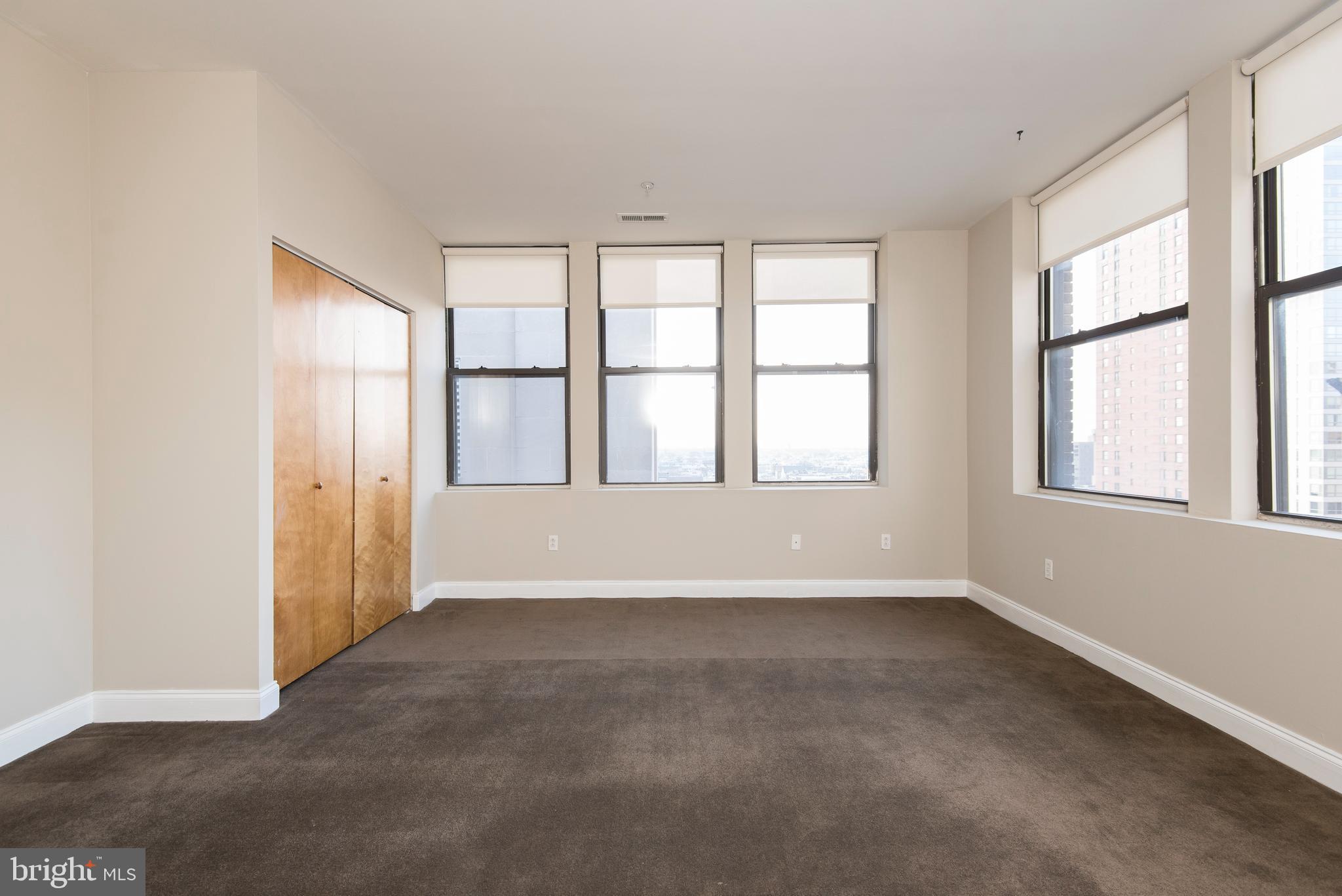 220 South 16th Street, Unit 1102 Philadelphia, PA 19102 - Photo 24 of 26 an empty room with windows