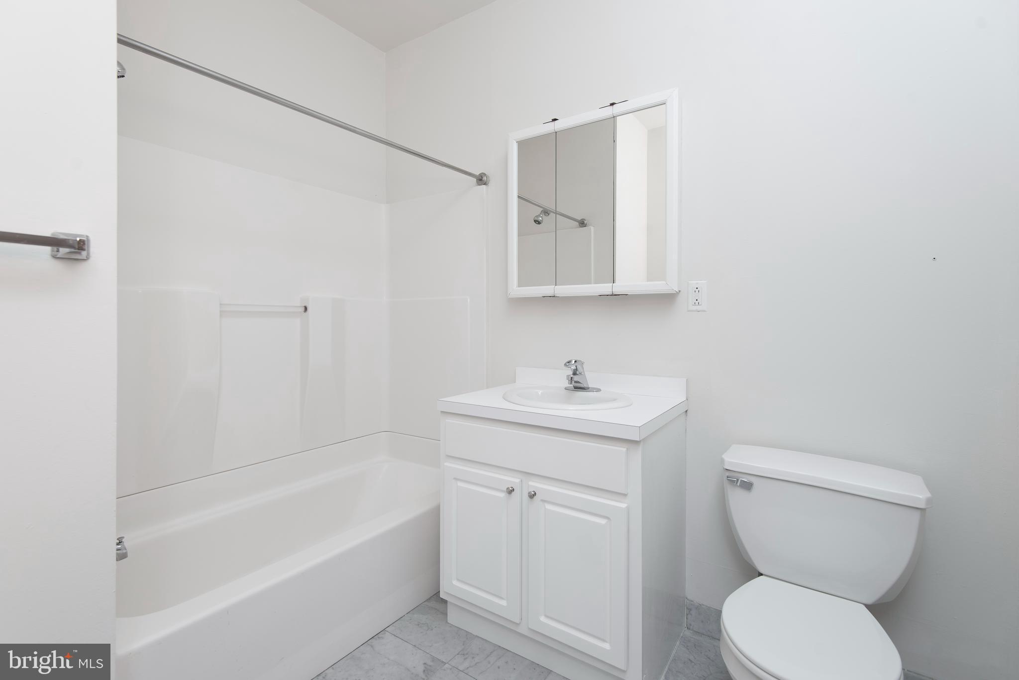 220 South 16th Street, Unit 1102 Philadelphia, PA 19102 - Photo 25 of 26 a bathroom with a toilet sink and bathtub