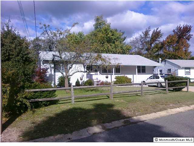513 Alfred Road Toms River, NJ 08757 - Photo 1 of 3 a front view of a house with garden