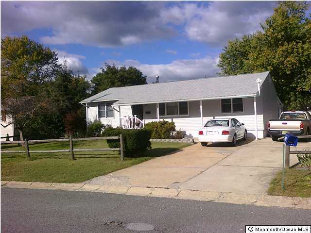 513 Alfred Road Toms River, NJ 08757 - Photo 2 of 3 a car parked in front of house