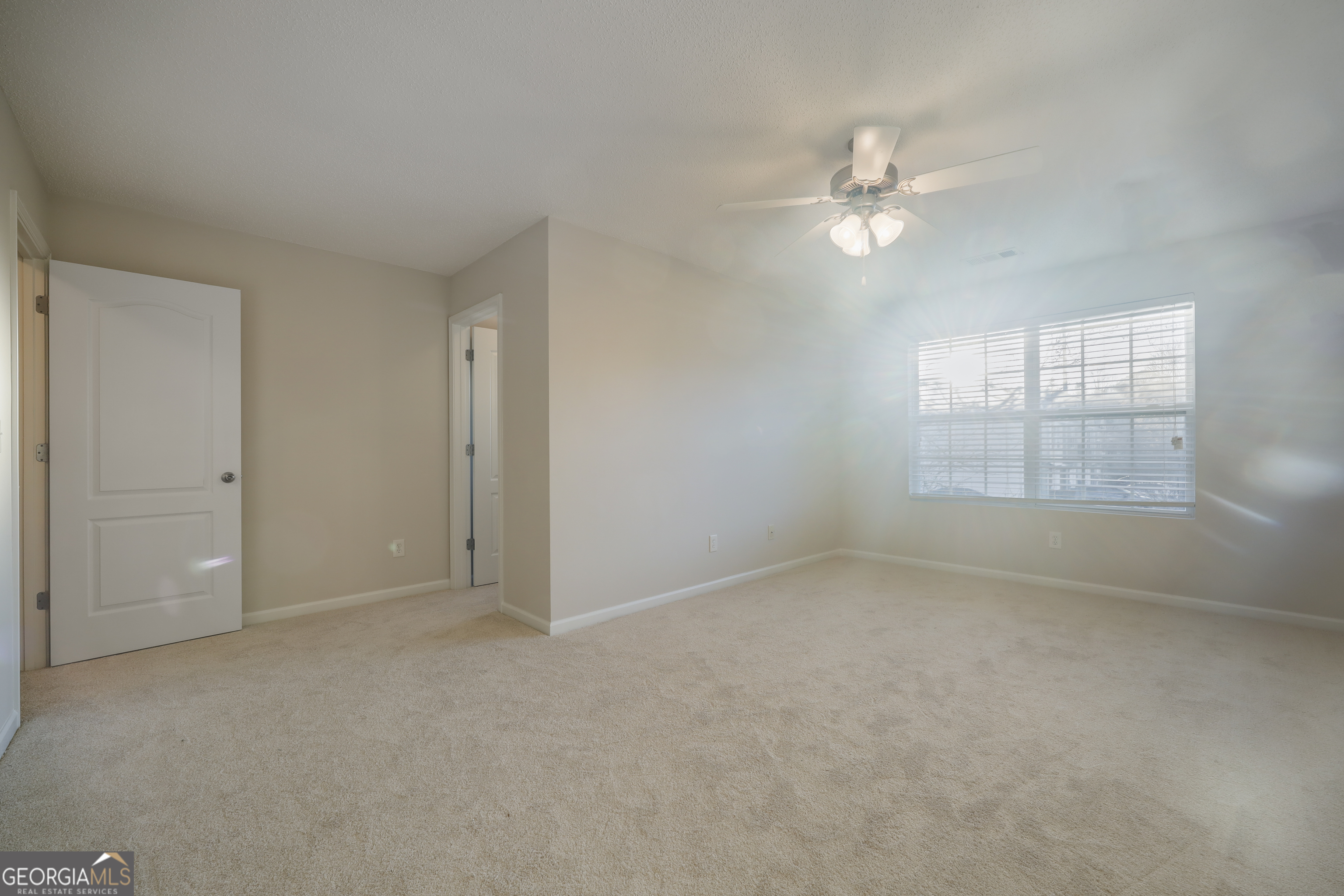 1442 Box Circle Winder, GA 30680 - Photo 11 of 25 an empty room with windows and fan