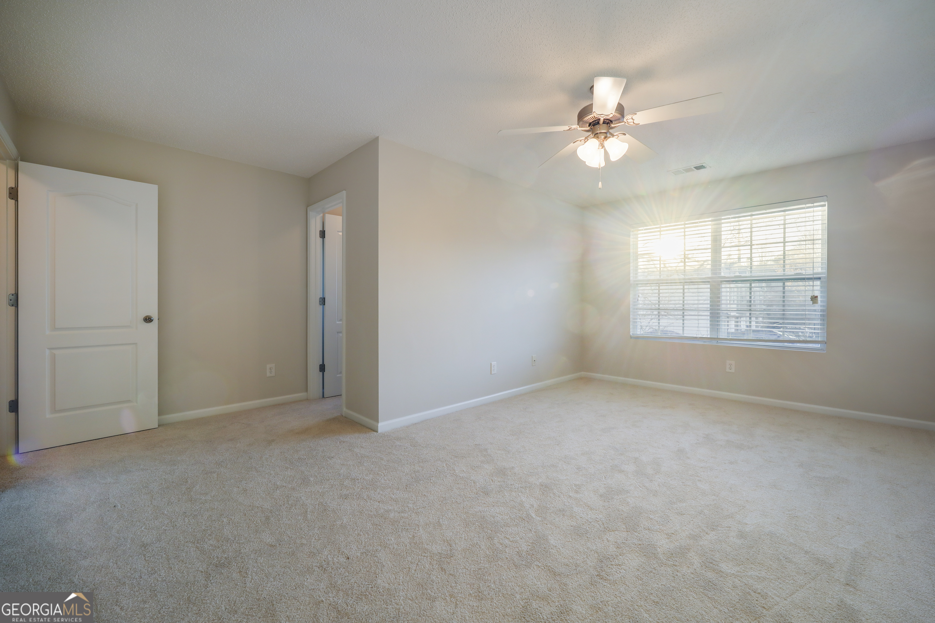 1442 Box Circle Winder, GA 30680 - Photo 13 of 25 an empty room with windows and fan