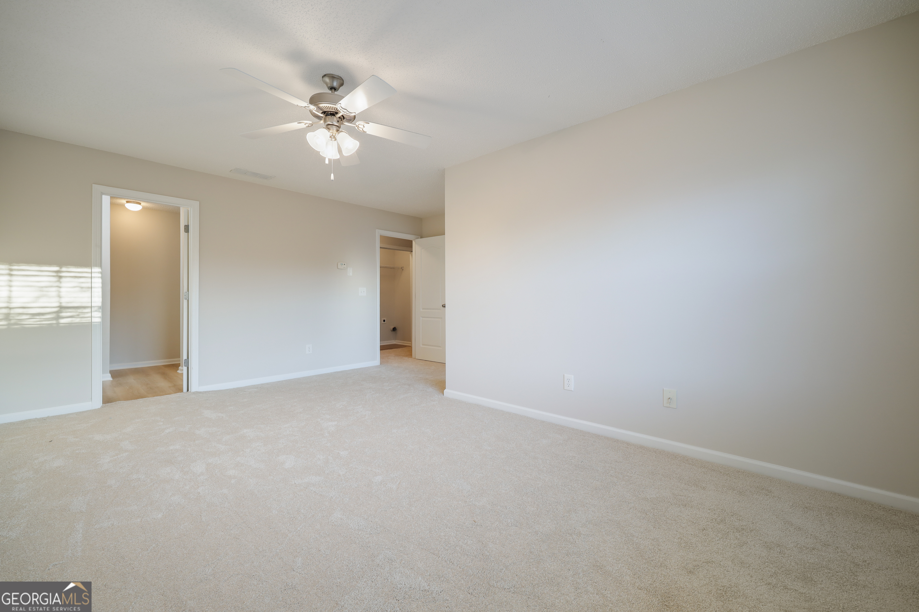 1442 Box Circle Winder, GA 30680 - Photo 14 of 25 a view of a livingroom with a ceiling fan and window