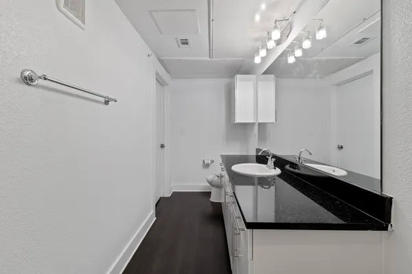 a kitchen with a sink and a refrigerator