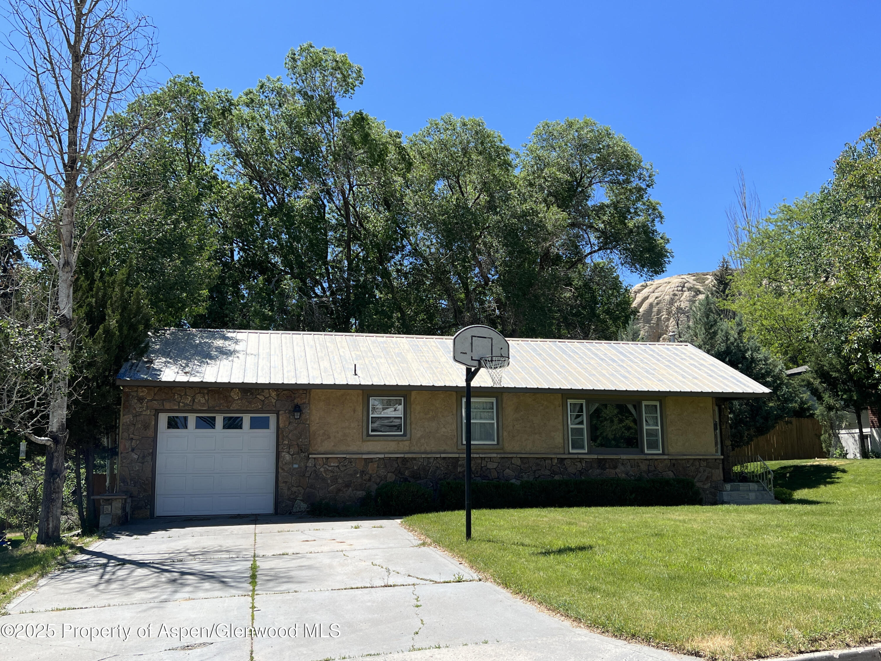 932 Ranney Street Craig, CO 81625 - Photo 1 of 23 a front view of a house with yard
