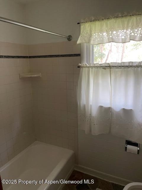932 Ranney Street Craig, CO 81625 - Photo 14 of 23 a bathroom with a shower