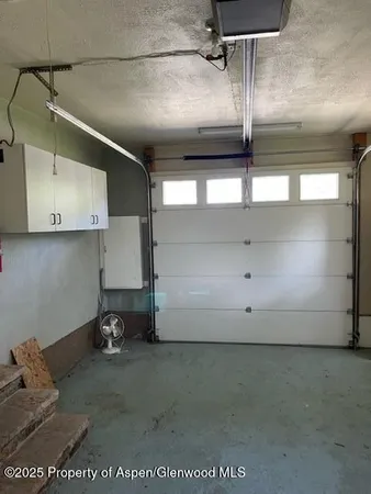 a room with cabinets and window