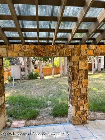 a view of a chairs and tables in the patio