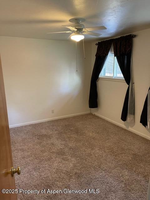932 Ranney Street Craig, CO 81625 - Photo 10 of 23 a view of a big room with wooden floor and windows