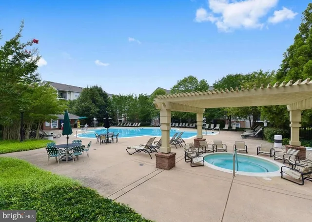 a view of a backyard with sitting area