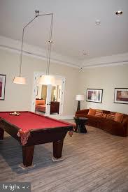 19609 Galway Bay Circle, Unit 303 Germantown, MD 20874 - Photo 20 of 22 a bedroom with a bed and a chandelier