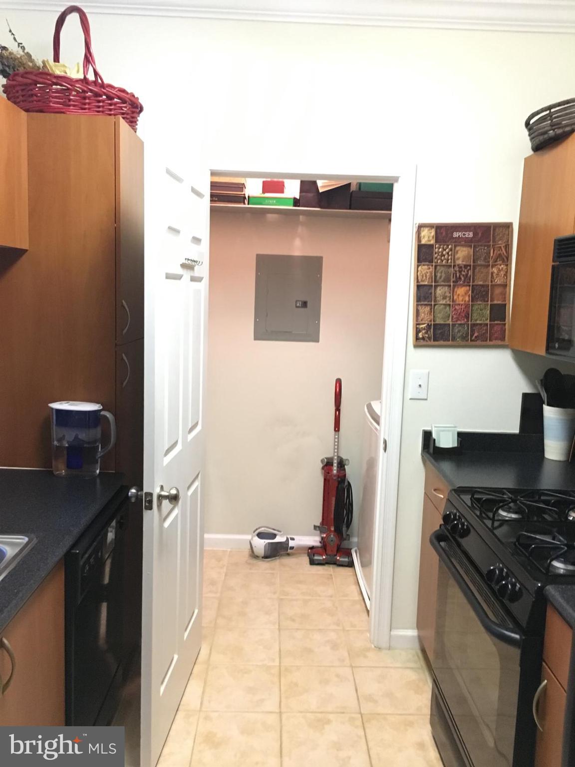 19609 Galway Bay Circle, Unit 303 Germantown, MD 20874 - Photo 6 of 22 a kitchen with a stove and a refrigerator