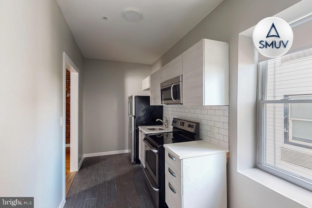 231 East North Avenue, Unit 222 Baltimore, MD 21202 - Photo 11 of 20 Modern kitchen with sleek appliances.