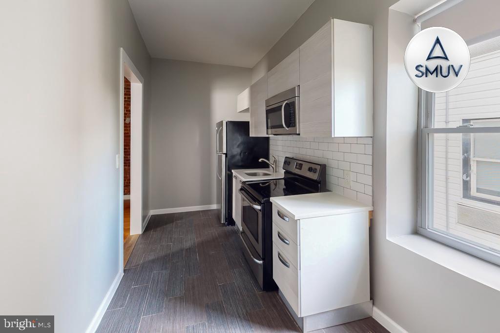 231 East North Avenue, Unit 222 Baltimore, MD 21202 - Photo 17 of 20 Modern kitchen with sleek finishes.